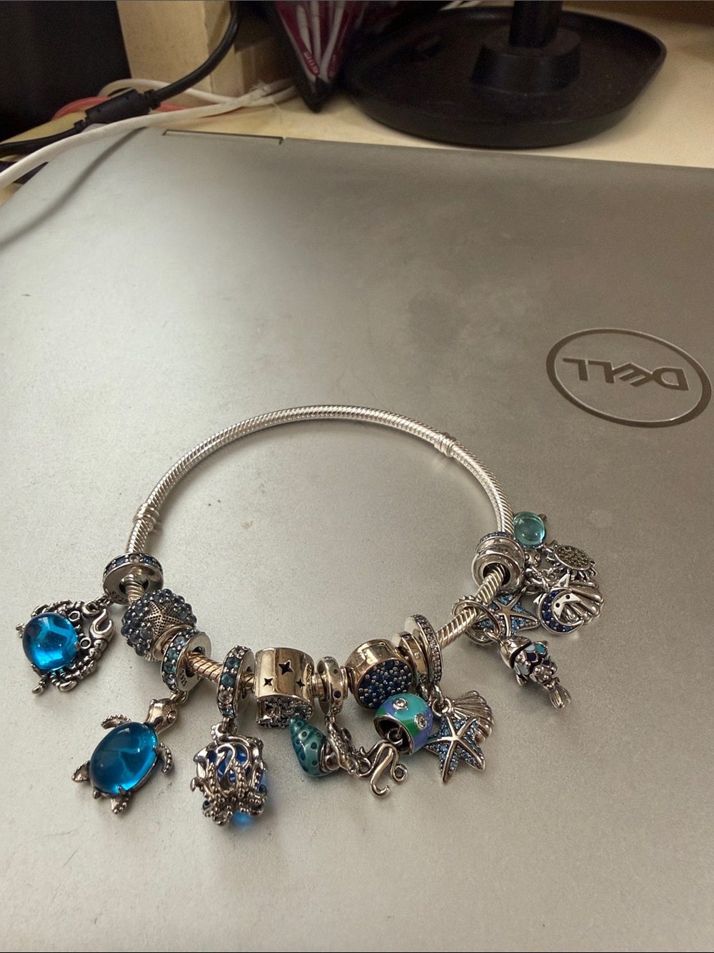 8” silver tone nautical bracelet. Jelly fish octopus crabs etc